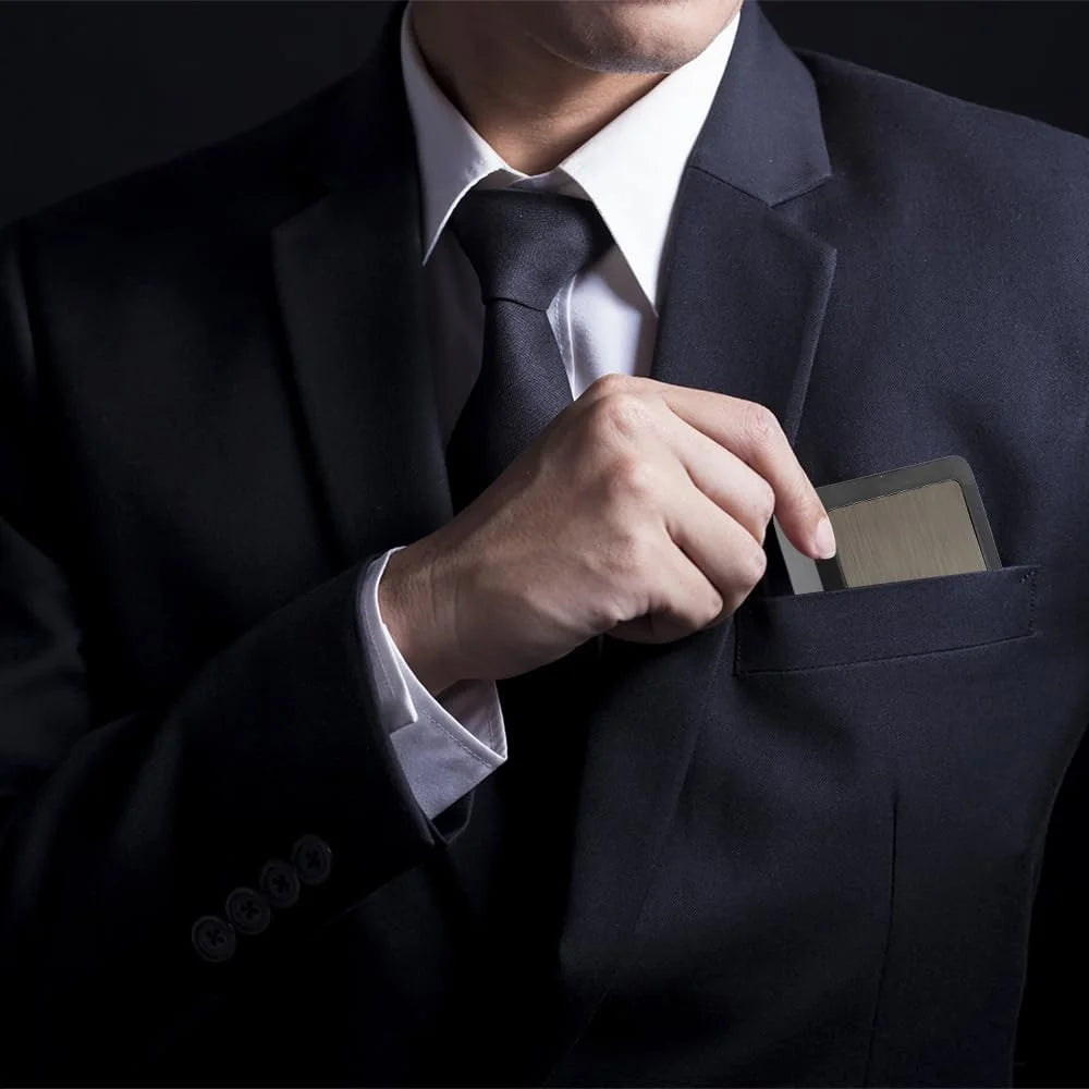 Person in a suit with a hand reaching into a pocket pulling cigarette case