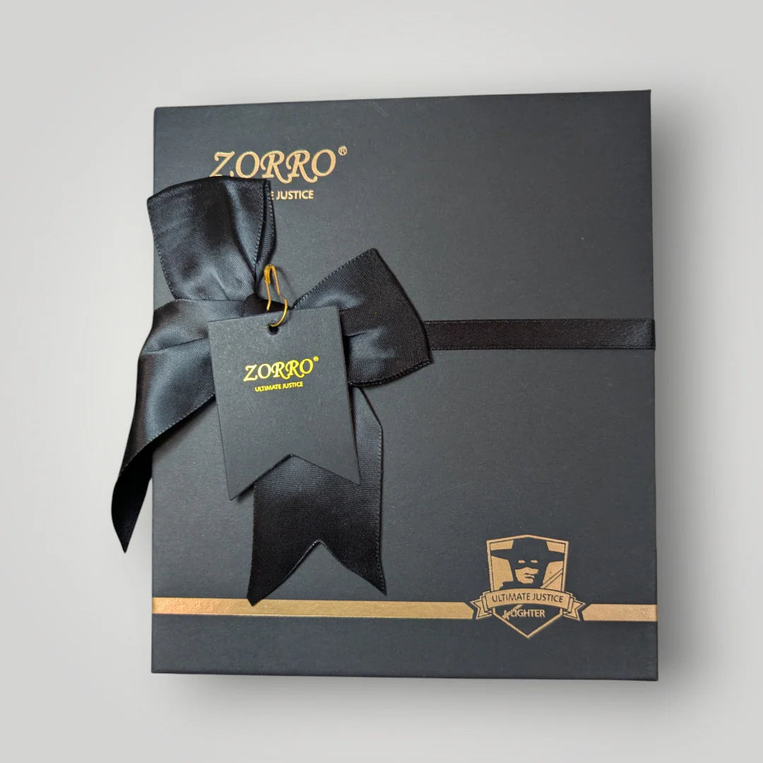 Zorro gift box with black ribbon and tag on a light gray background