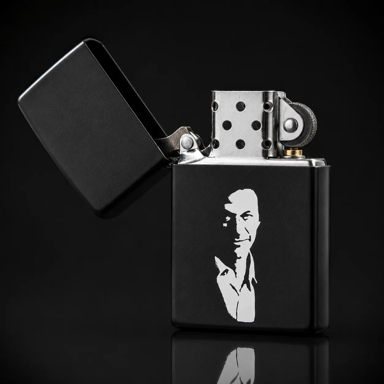 Black Zippo Lighter with imran khan sticker on it. Lid open of zippo