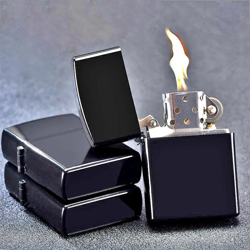Black lighter with flame on a gray background