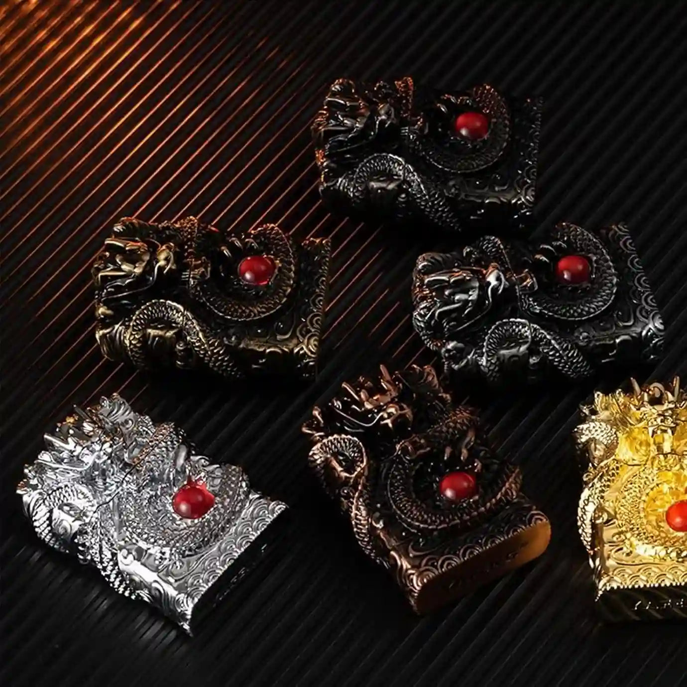 Decorative brooches with red gemstones on a black and gold striped background