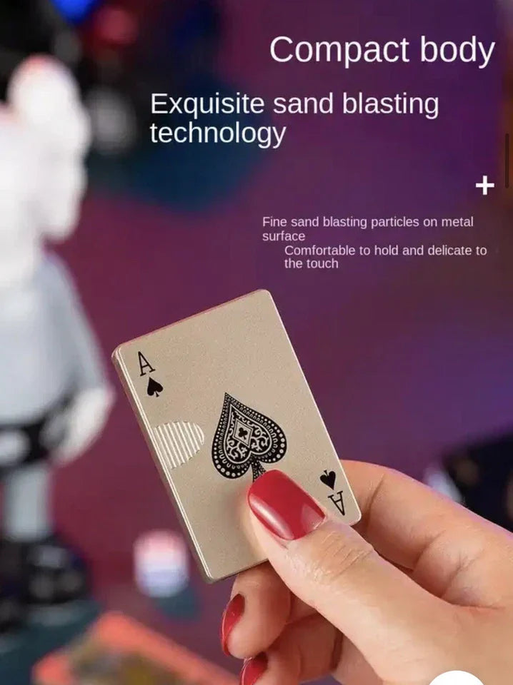 compact body gold playing card lighter holding in hand